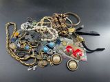 a pile of assorted jewelry on a table
