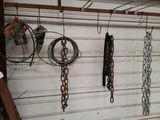 many chains hanging on the wall of a garage