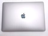 an apple logo on the back of an apple laptop