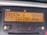 a digital clock on the dashboard of a car