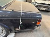 a black car with a rope on the back of it