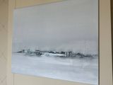 a painting on the wall of a living room