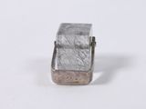 an image of a small silver ring on a white surface