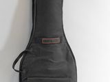 an image of a guitar case sitting on top of a white wall