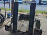 a flat bed trailer with a flat bed attached to it