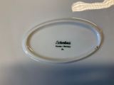a close up of a plate with a name on it
