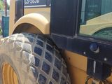a large tractor that is parked on the side of the road