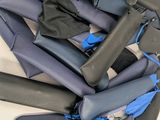 a pile of wetsuits that are sitting on a table