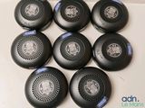 six black speakers are sitting on top of a white surface
