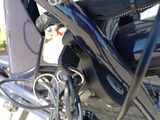 a close up of a bike with a seat and handlebars