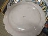 a white plate sitting on top of a blue and white plate