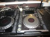two cd players that are sitting on a table