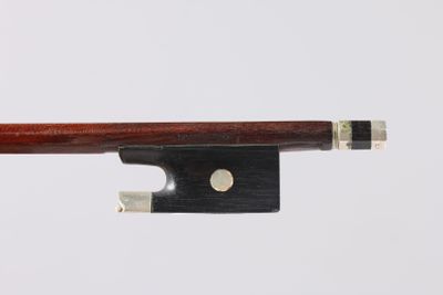 a close up of a violin bow on a white background