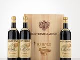 three bottles of wine in front of a wooden box