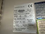 a close up of a sign on a wall with a lot of information