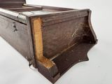 an old wooden box with a metal latch on it