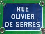 a blue sign that says rue oliver de serres on it