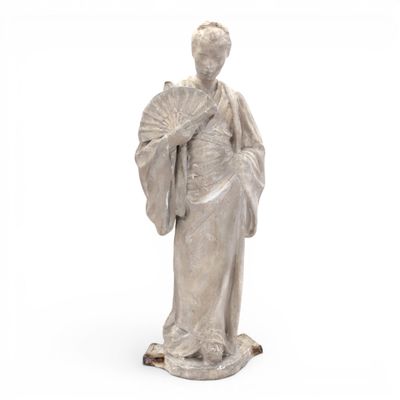 statue of a woman holding a fan and a fan in her hand
