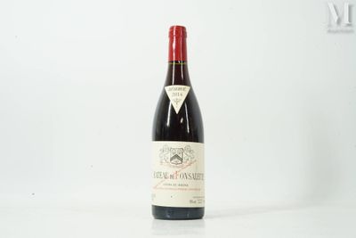 a bottle of wine that is sitting on a table