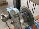 an image of a machine that is working on a piece of metal