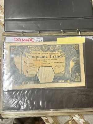 a suitcase with a note inside of it on the floor
