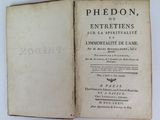 an old book opened to show the title of a poem