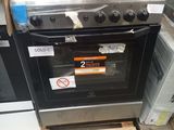 a stove that is sitting on a pallet in a store