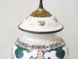 a white vase with a colorful design on it