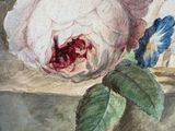 a painting of a rose on a wooden block
