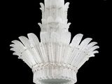 a chandelier made of white plastic feathers on a black background