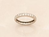 an image of a diamond wedding ring on a table