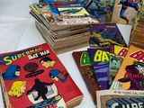 a lot of comic books that are on the table