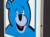 a picture of a blue bear on the wall