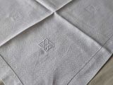 the table cloth is white and has a diamond design on it