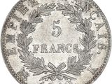 a silver five franc coin on a white background