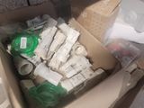 a cardboard box filled with toilet paper and other items