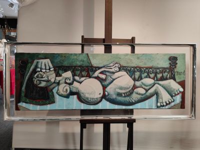 a picture of a painting on a easel in a room