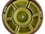 a green plate with a circular design on it