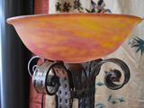 a bowl that is sitting on a metal stand