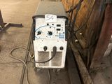 a machine that is sitting on the side of a building
