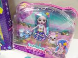 a small doll with a blue hair and a dress