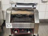 a toaster that is sitting on the floor in the kitchen