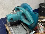 a blue machine that is sitting on top of a table