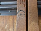a close up of a piece of wood that has a stamp on it