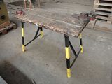 an image of a work table in the middle of a construction site