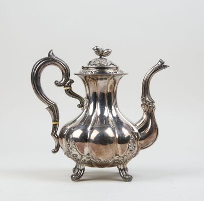 an antique silver teapot with ornate decoration on a white background