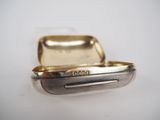 a close up of a silver case with a silver handle