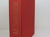 a red book that is sitting on a table