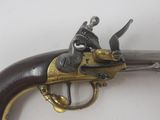 an old gun that is on display on a table