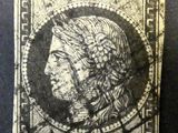 un timbre sur lequel figure le visage d'une femme